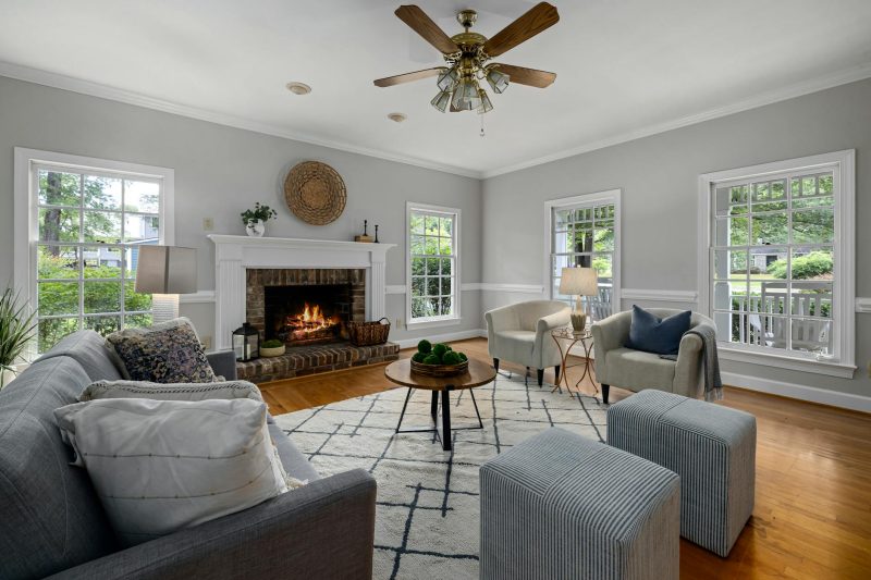 Bright living room with fireplace modern furniture and nature