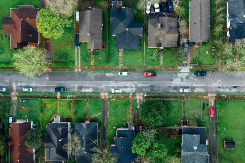 High angle aerial shot of a suburban neighborhood street